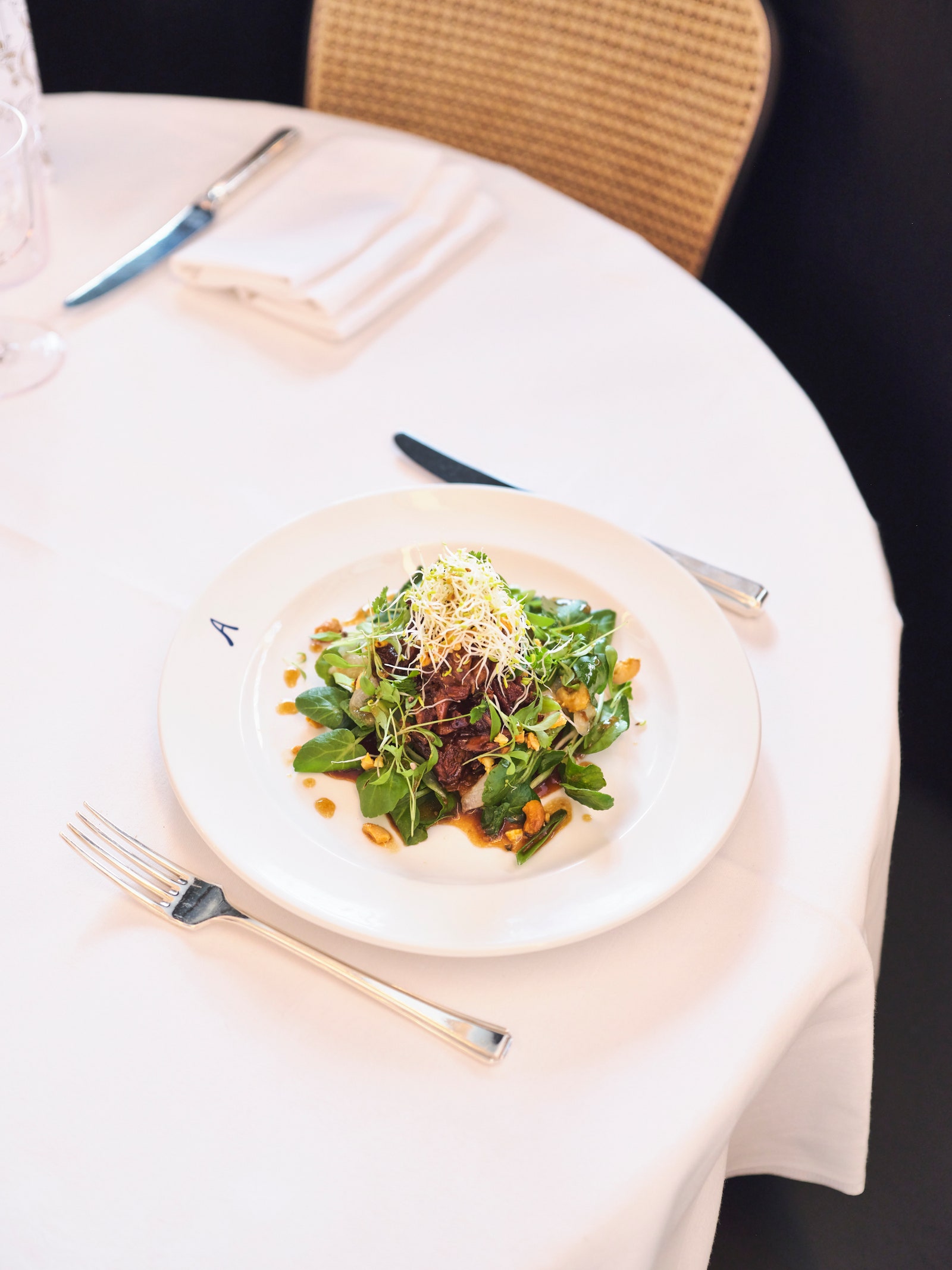 Image may contain Food Food Presentation Blade Knife Weapon Chair Furniture Plate Cutlery Fork and Dining Table
