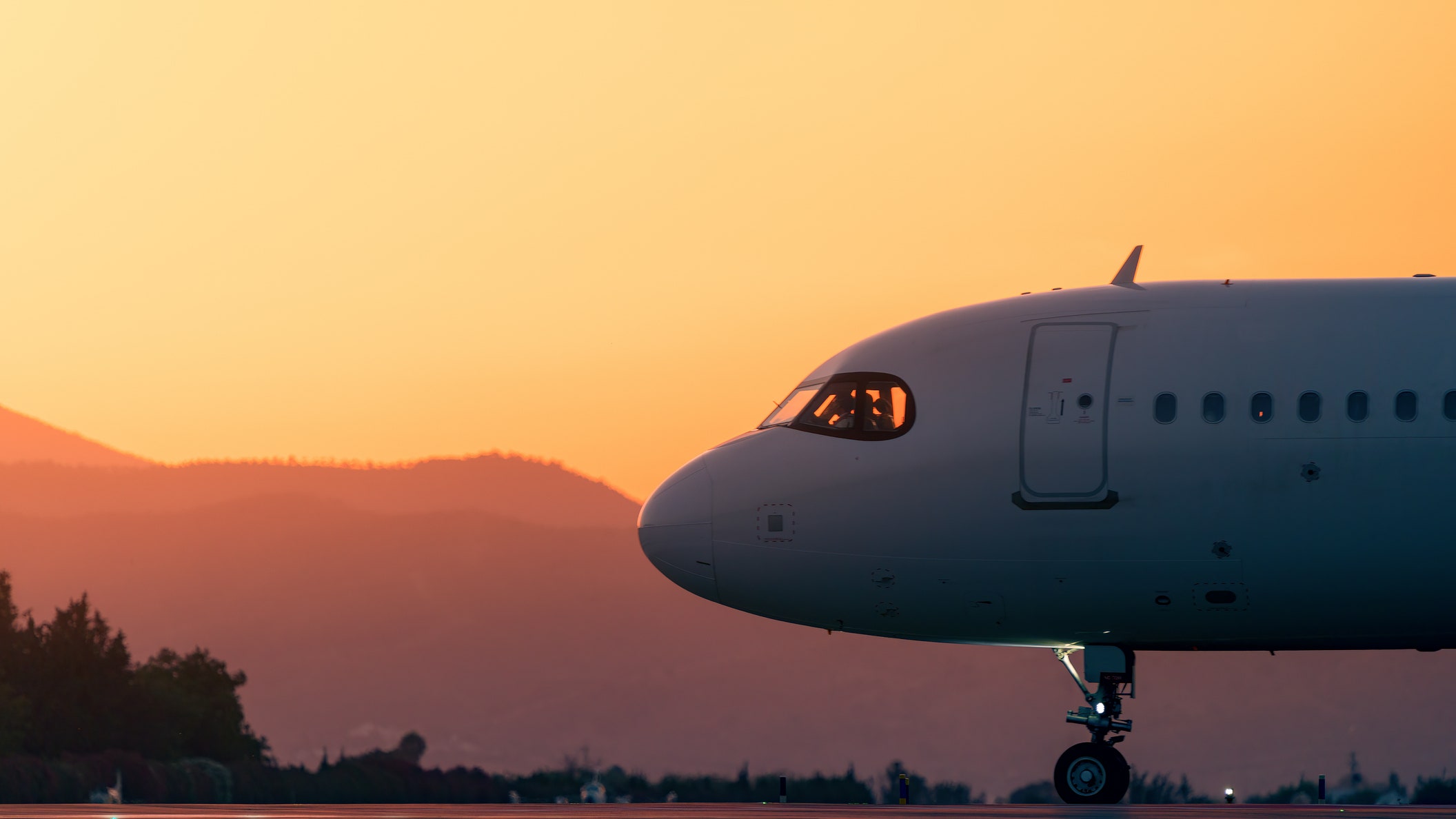 closeup of an airplane cockpit as it gracefully makes its way onto the runway ready to take flight into the enchanting...